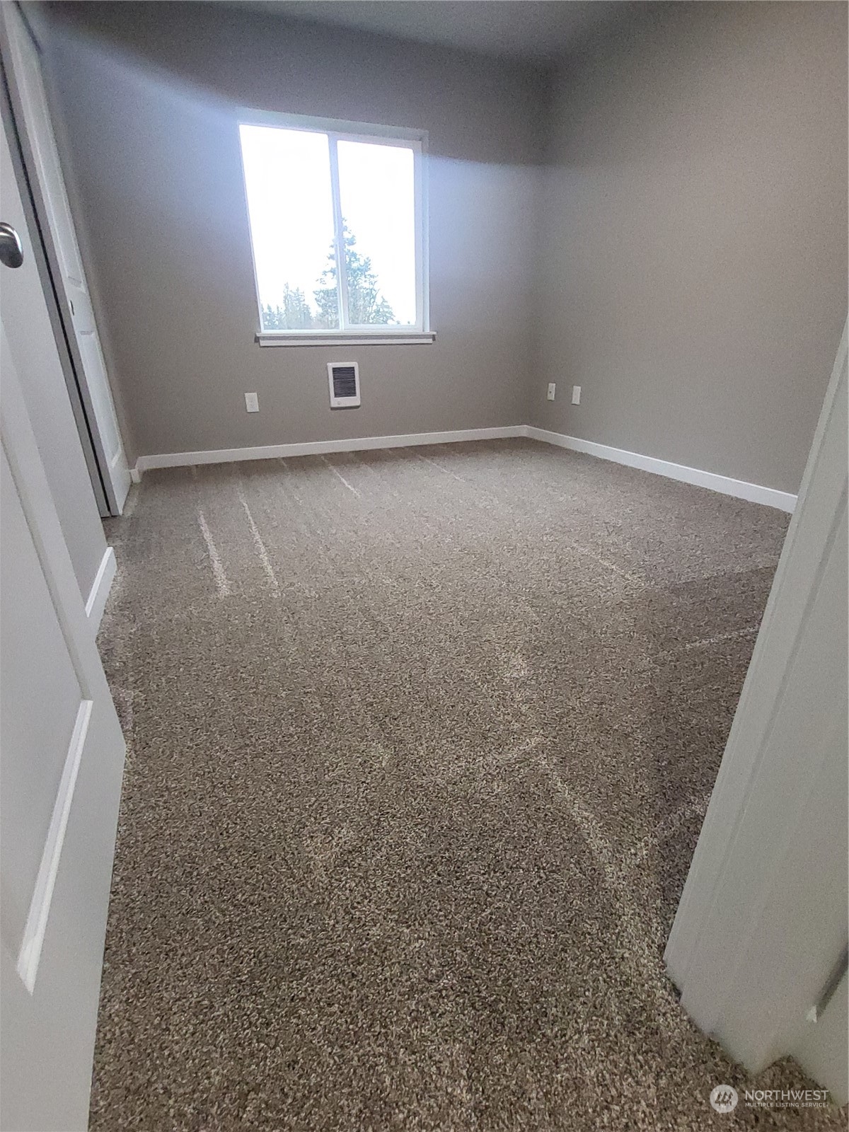 1026 Peach Road Winlock, WA 98596 - Photo 24 of 37 an empty room with windows