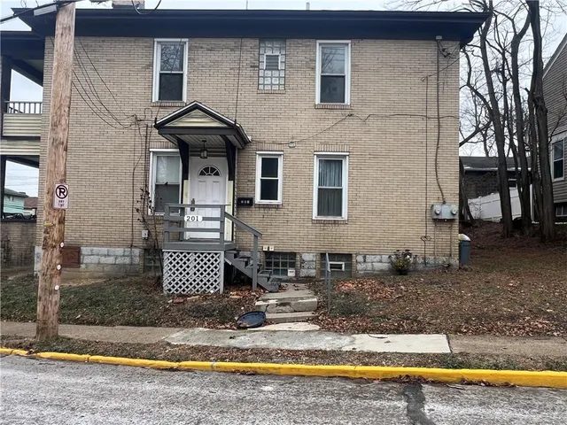 a front view of a house with swimming pool