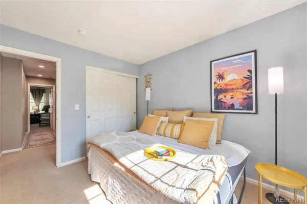 a bedroom with a bed and cupboard