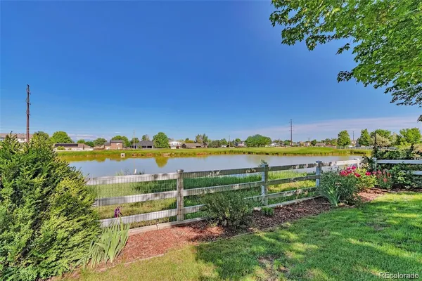 a view of a garden with a lake view