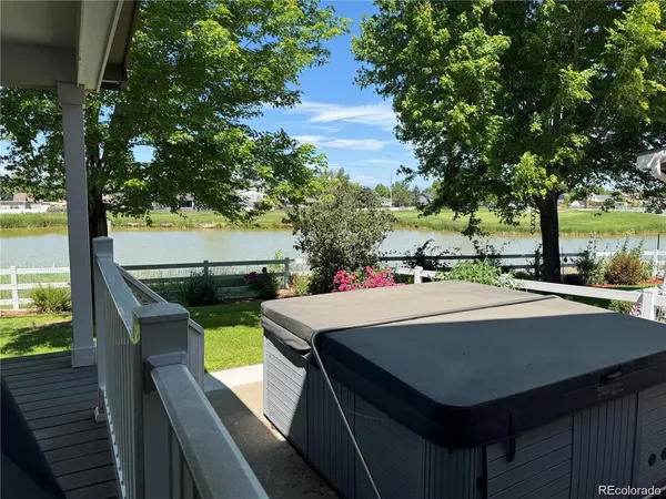 a view of a balcony with table and chairs
