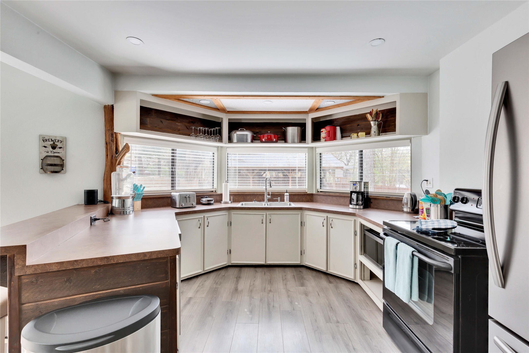 16108 Aqua Azul Path Austin, TX 78734 - Photo 14 of 40 a kitchen with stainless steel appliances a sink and a stove