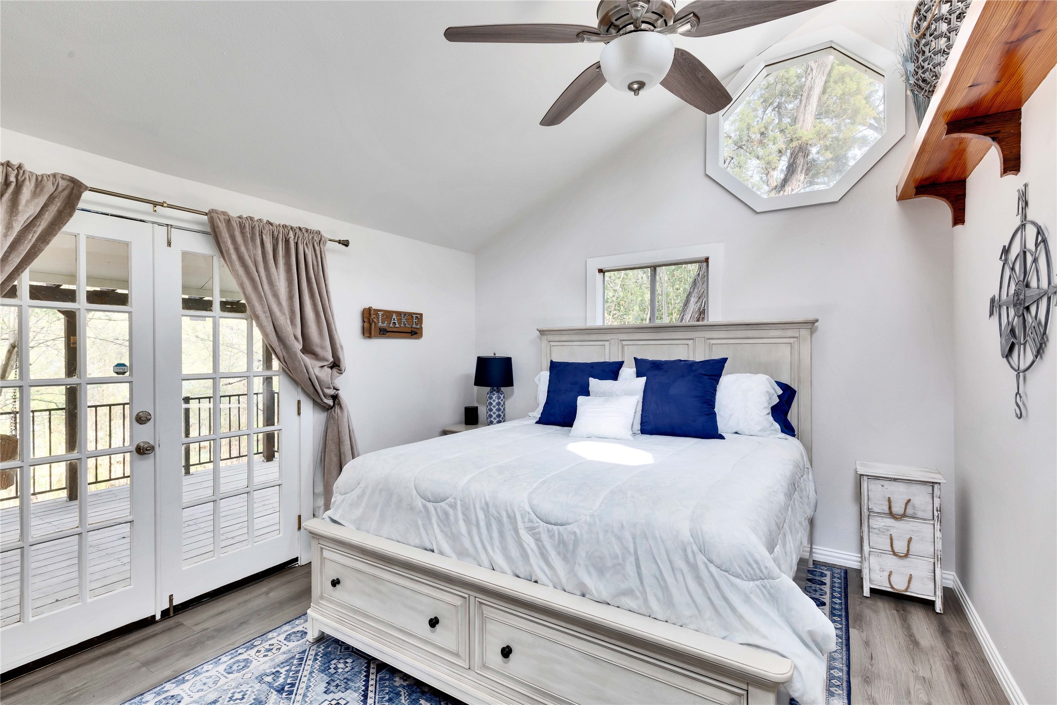 16108 Aqua Azul Path Austin, TX 78734 - Photo 18 of 40 a bedroom with a bed and a chandelier