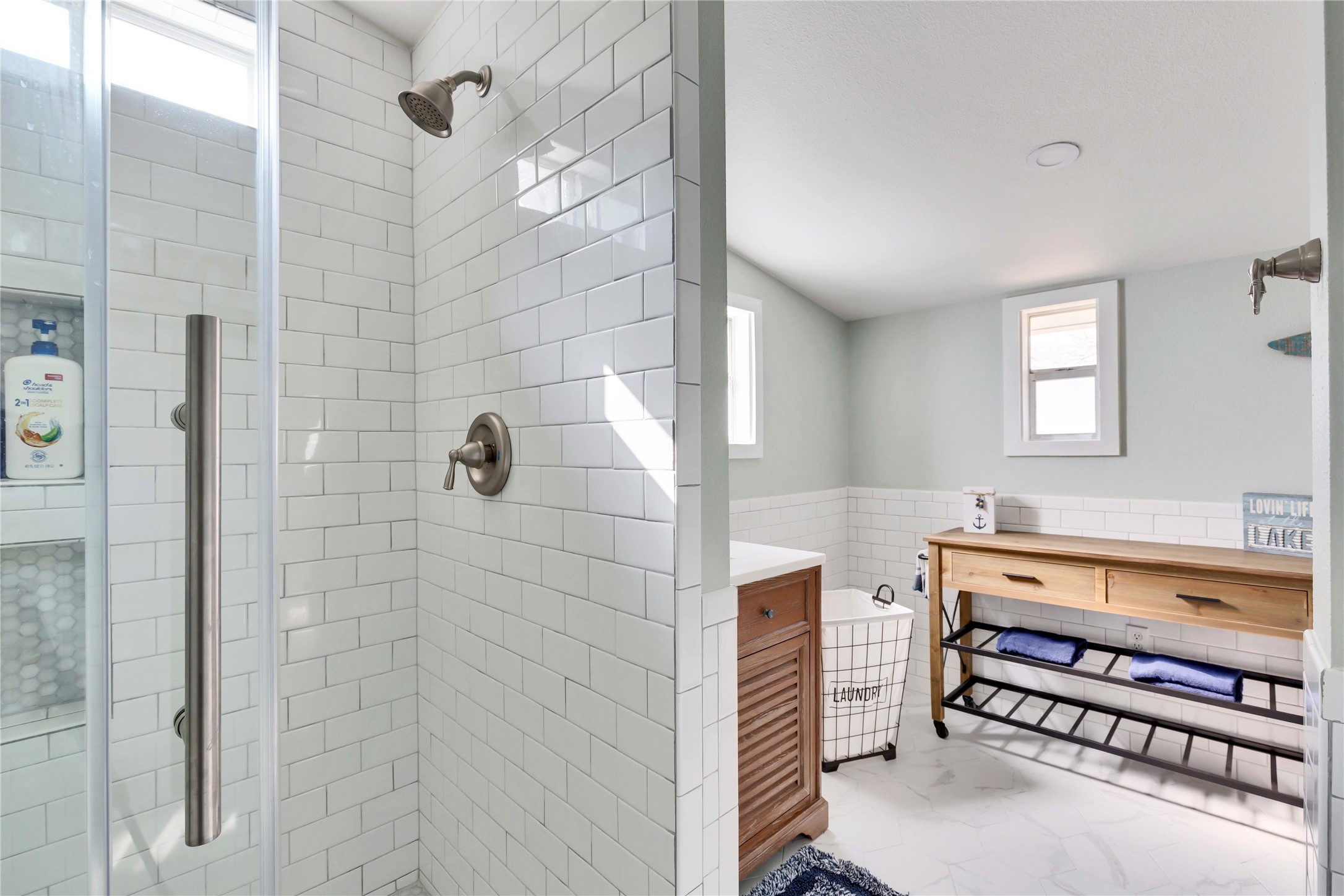 16108 Aqua Azul Path Austin, TX 78734 - Photo 25 of 40 a bathroom with a sink and a shower