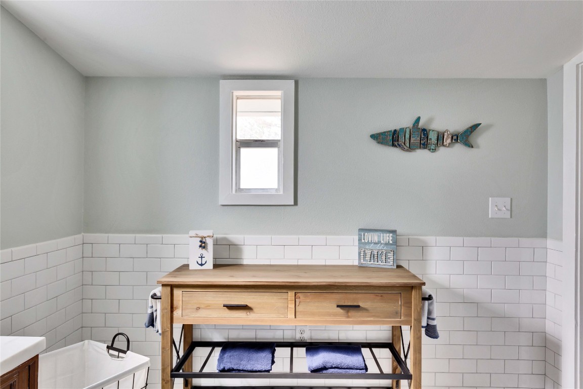 16108 Aqua Azul Path Austin, TX 78734 - Photo 26 of 40 a bathroom with a sink a vanity and a toilet