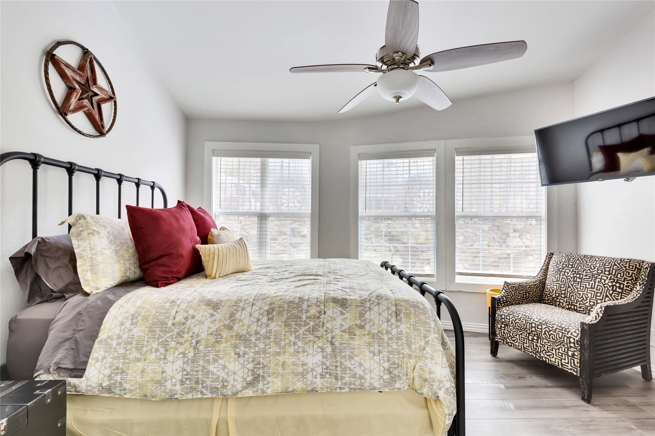 16108 Aqua Azul Path Austin, TX 78734 - Photo 27 of 40 a bedroom with a large bed and a couch
