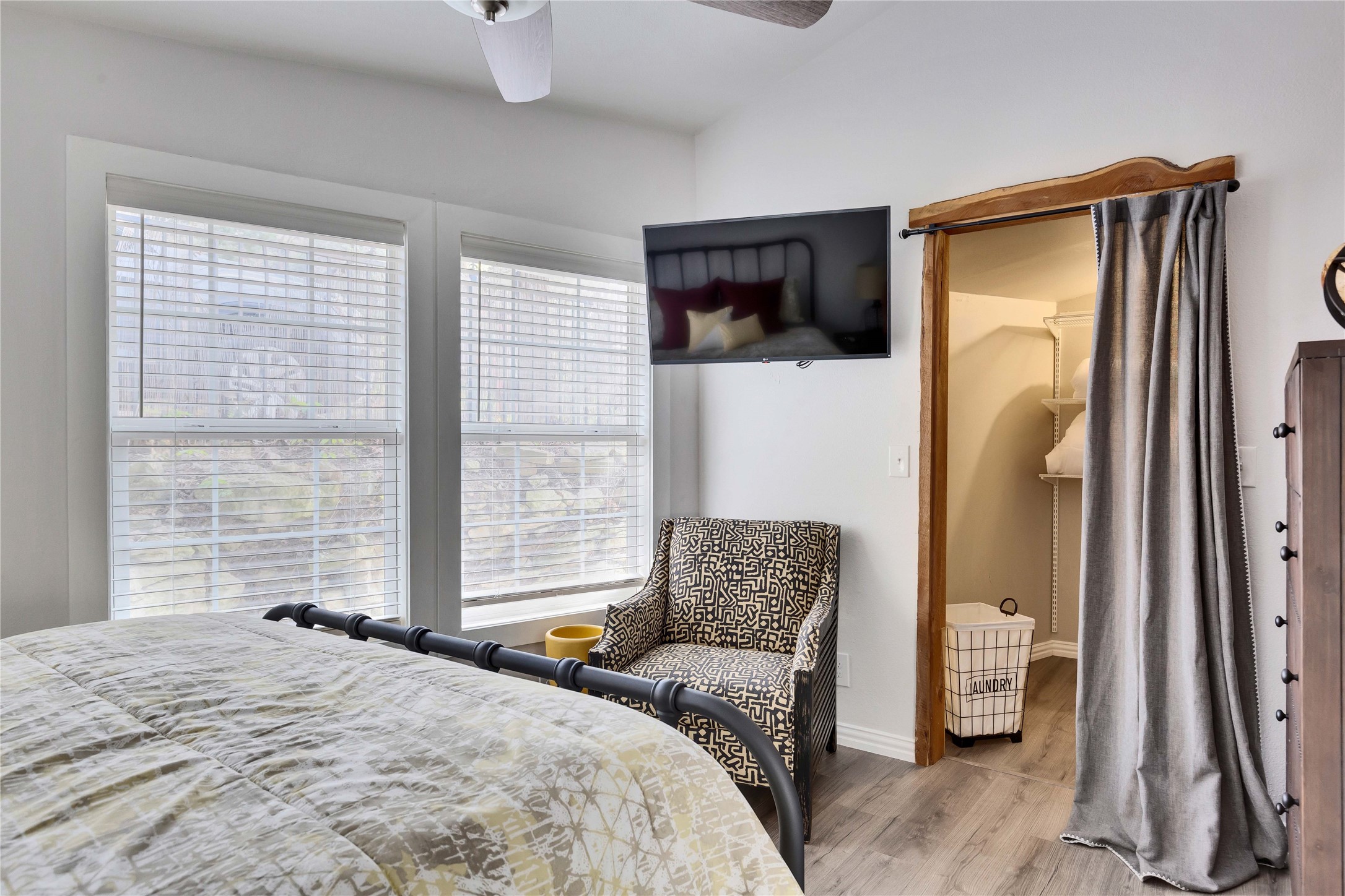 16108 Aqua Azul Path Austin, TX 78734 - Photo 30 of 40 a bedroom with a bed couch and a window