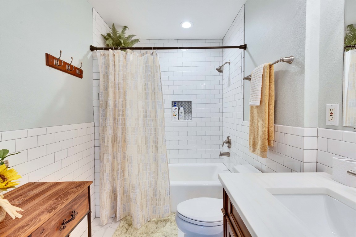 16108 Aqua Azul Path Austin, TX 78734 - Photo 31 of 40 a bathroom with a sink a toilet and shower