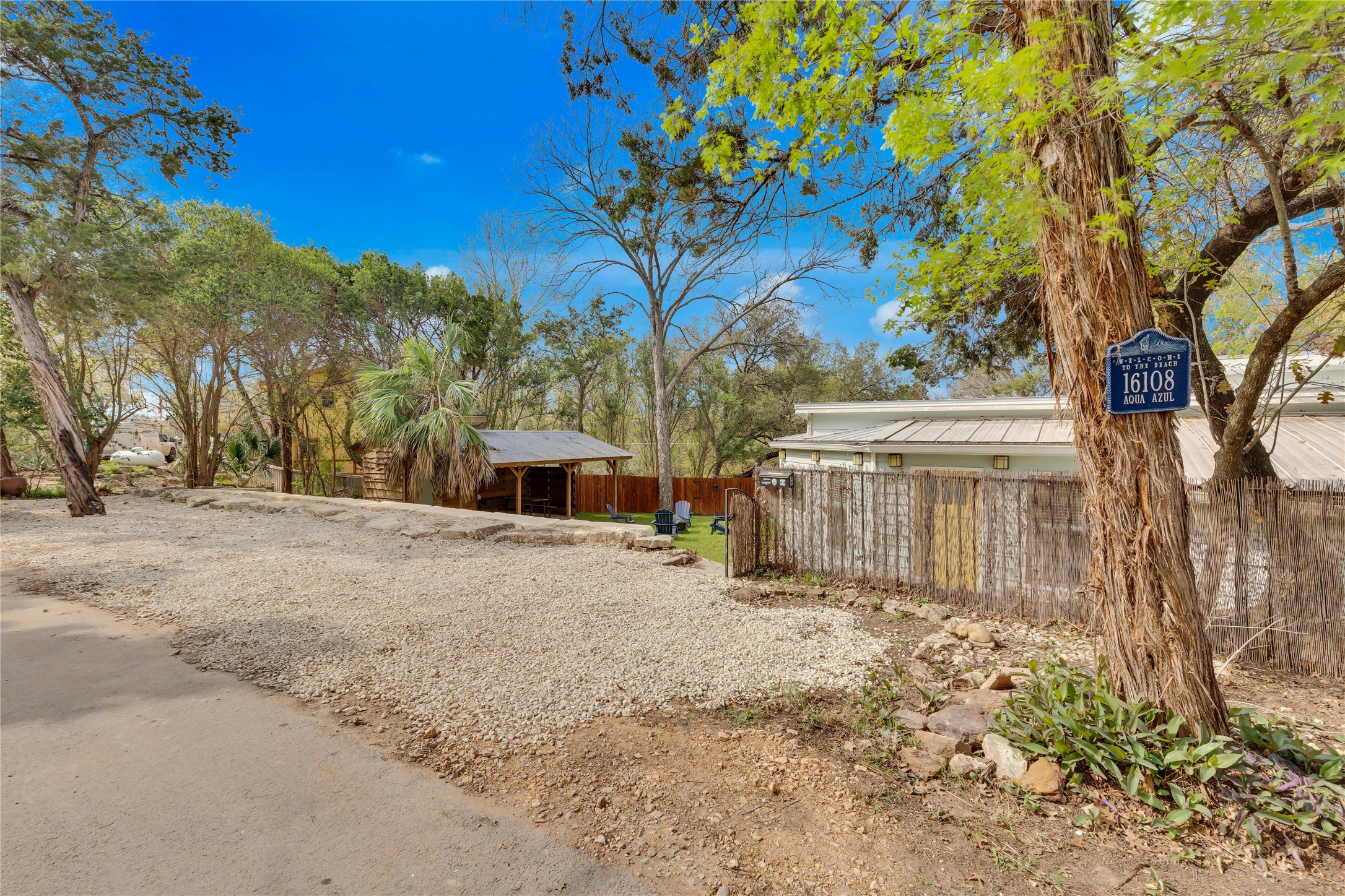 16108 Aqua Azul Path Austin, TX 78734 - Photo 5 of 40 a view of a house with a tree