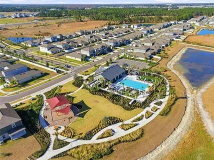 an aerial view of residential houses with outdoor space