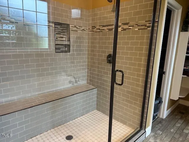 a bath tub sitting next to a window