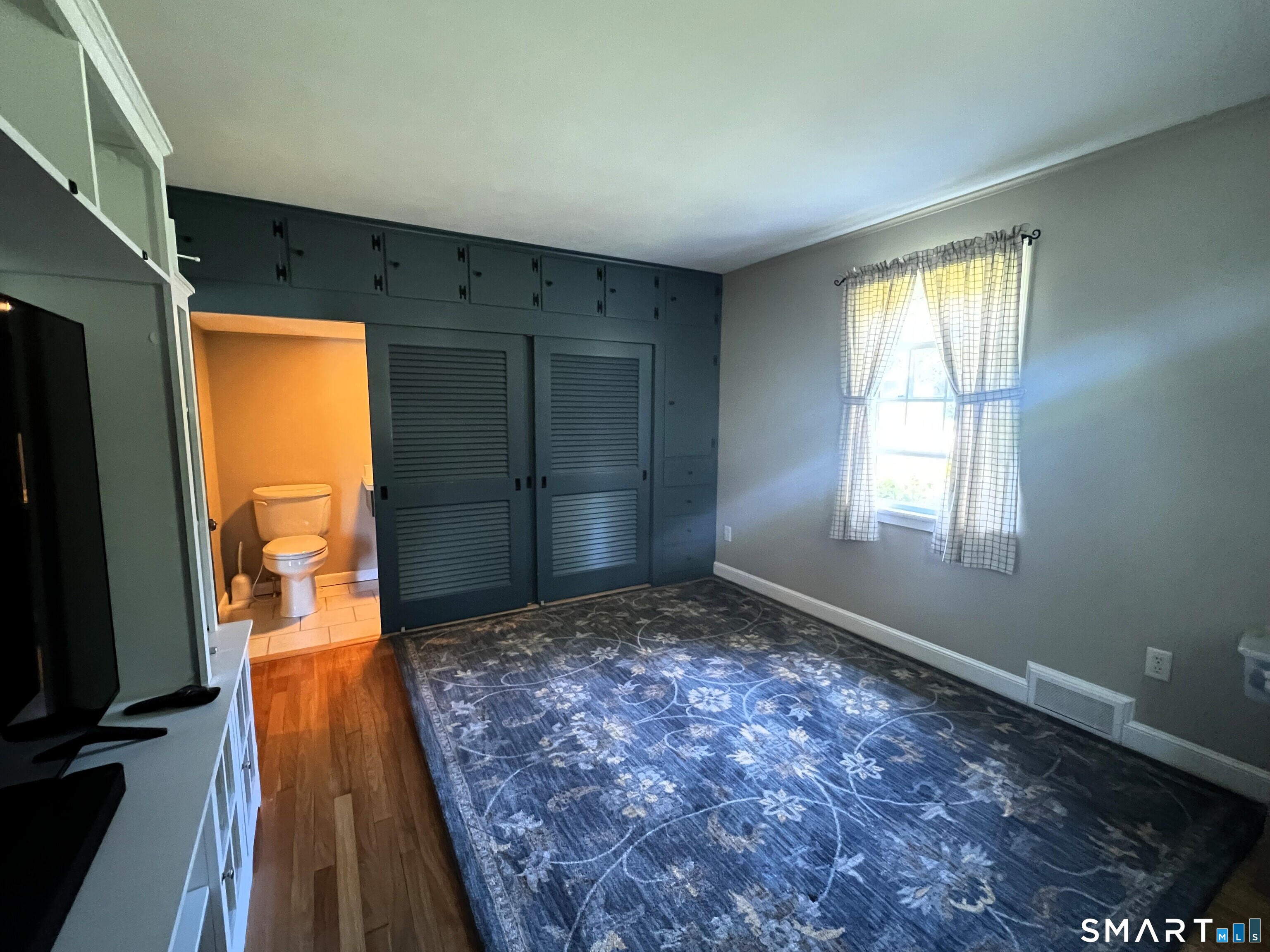 57 Hickory Hill Road Thomaston, CT 06787 - Photo 13 of 36 Primary Bedroom with custom cabinetry and half bath