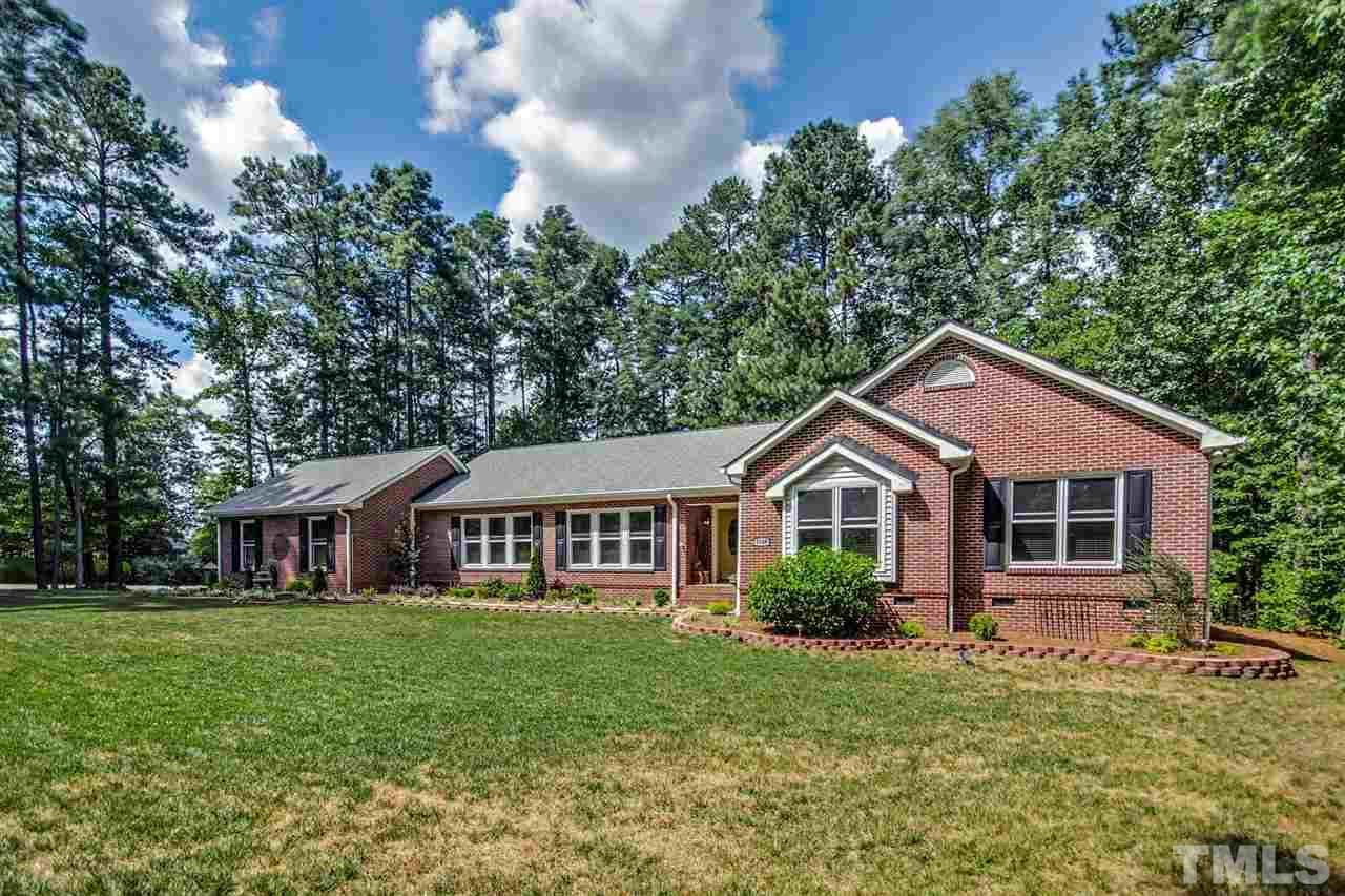 3148 Mt Vernon Church Road Raleigh, NC 27613 - Photo 2 of 29 a front view of a house with a yard and green space