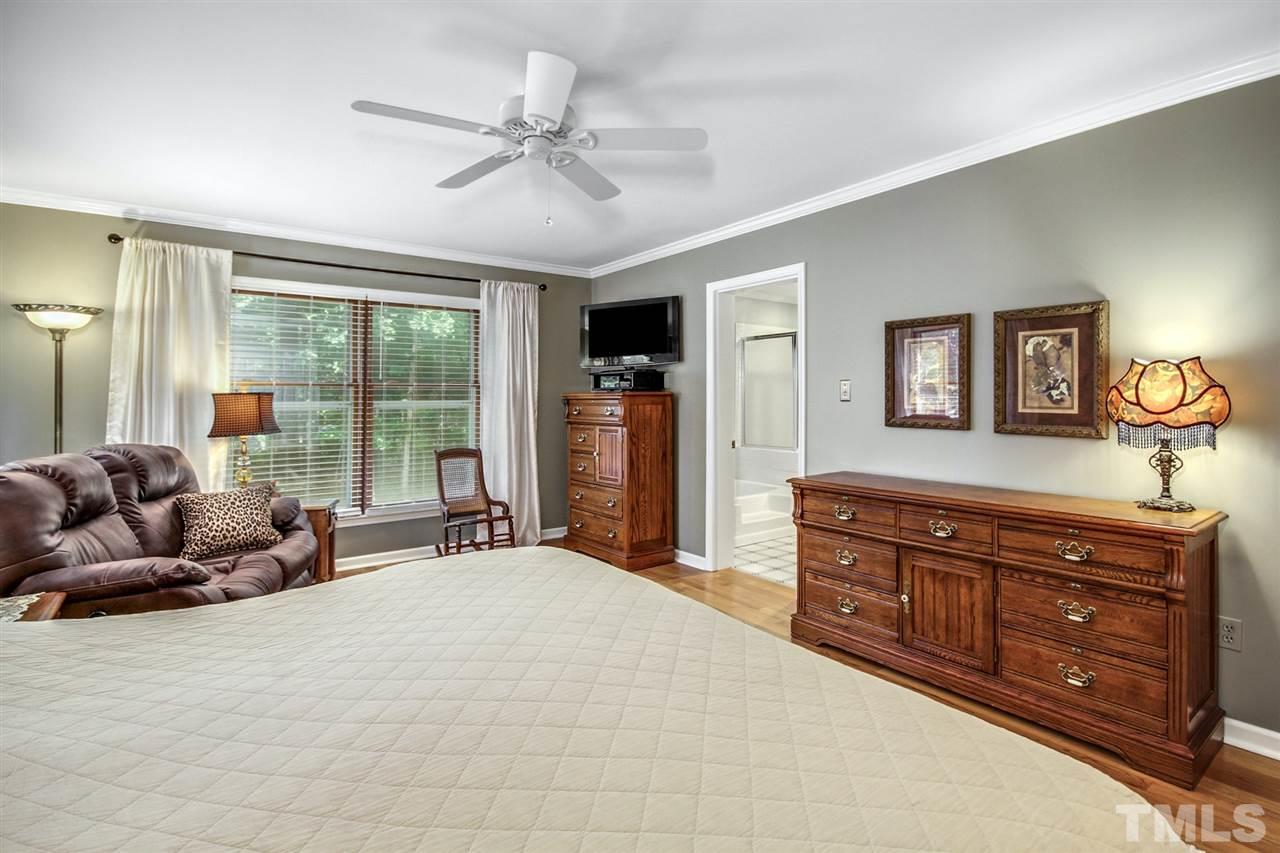 3148 Mt Vernon Church Road Raleigh, NC 27613 - Photo 16 of 29 a bed room with a bed and a dresser