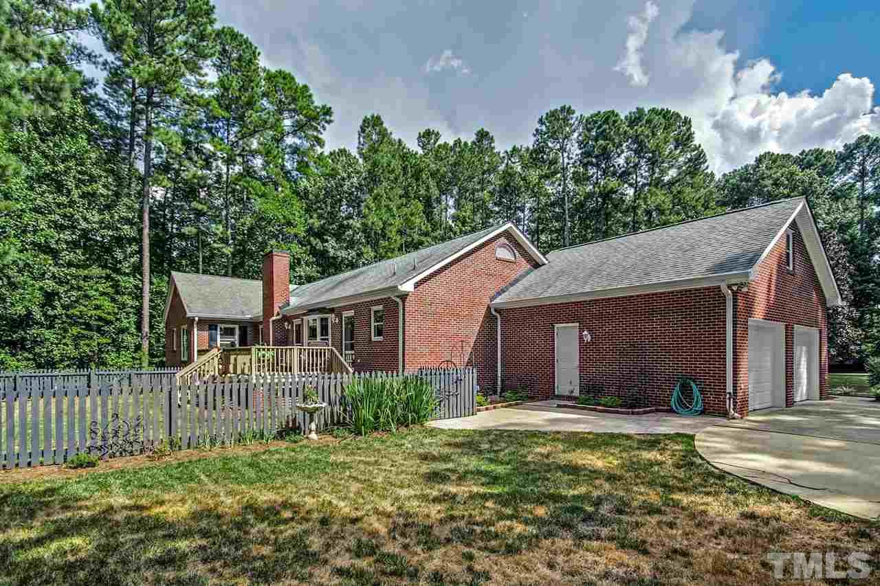 3148 Mt Vernon Church Road Raleigh, NC 27613 - Photo 26 of 29 a view of a house with a yard and plants