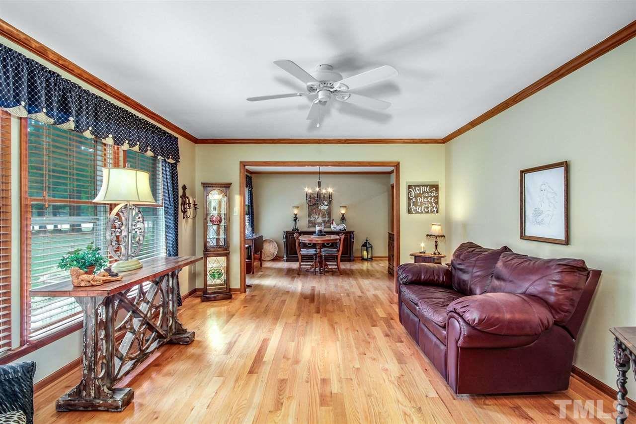 3148 Mt Vernon Church Road Raleigh, NC 27613 - Photo 5 of 29 a living room with furniture and a wooden floor