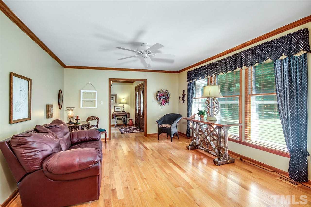 3148 Mt Vernon Church Road Raleigh, NC 27613 - Photo 6 of 29 a living room with furniture and a large window
