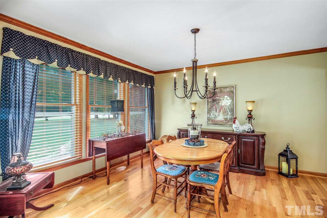 3148 Mt Vernon Church Road Raleigh, NC 27613 - Photo 7 of 29 a dining room with furniture and wooden floor