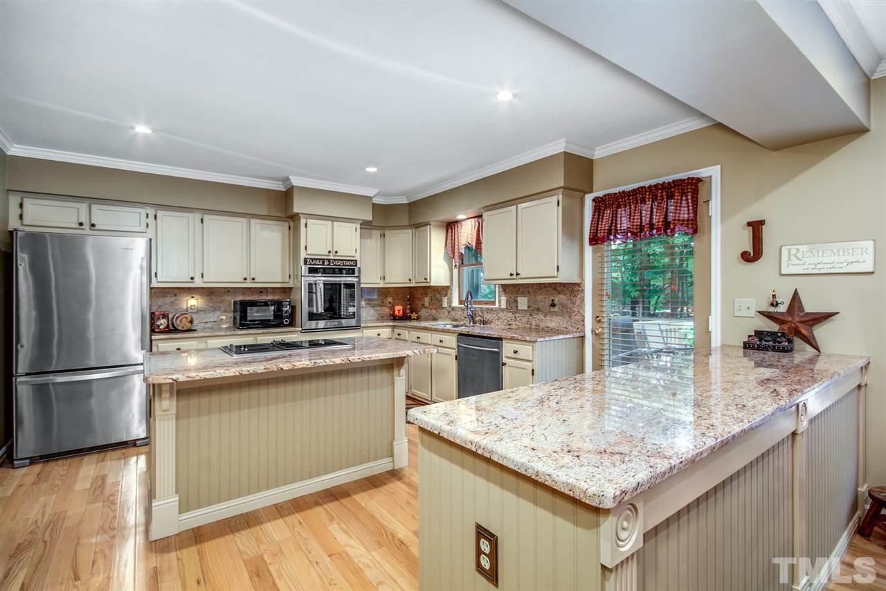 3148 Mt Vernon Church Road Raleigh, NC 27613 - Photo 9 of 29 a kitchen with stainless steel appliances granite countertop a sink stove and refrigerator