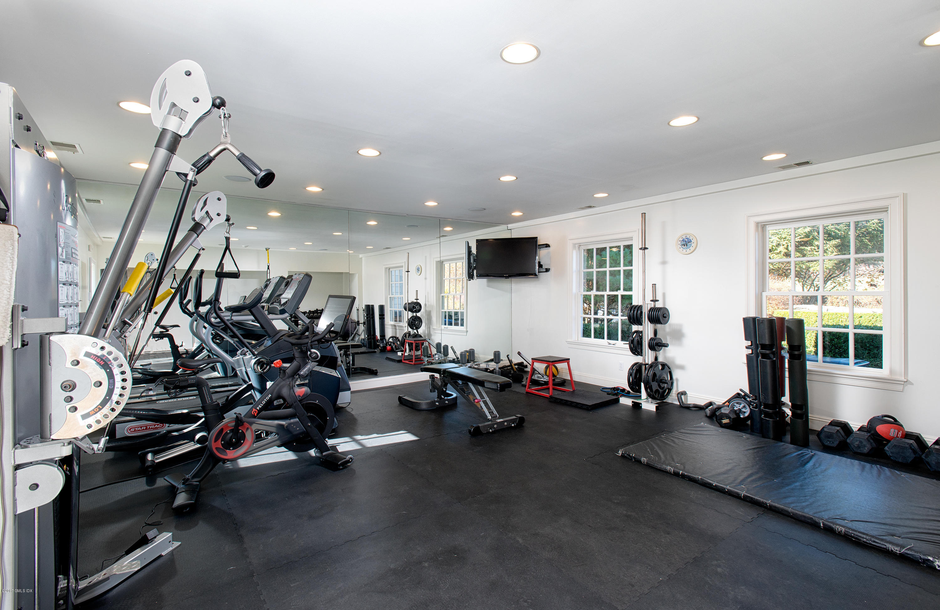 8 Mountain Wood Drive Greenwich, CT 06830 - Photo 20 of 22 a view of a room with gym equipment