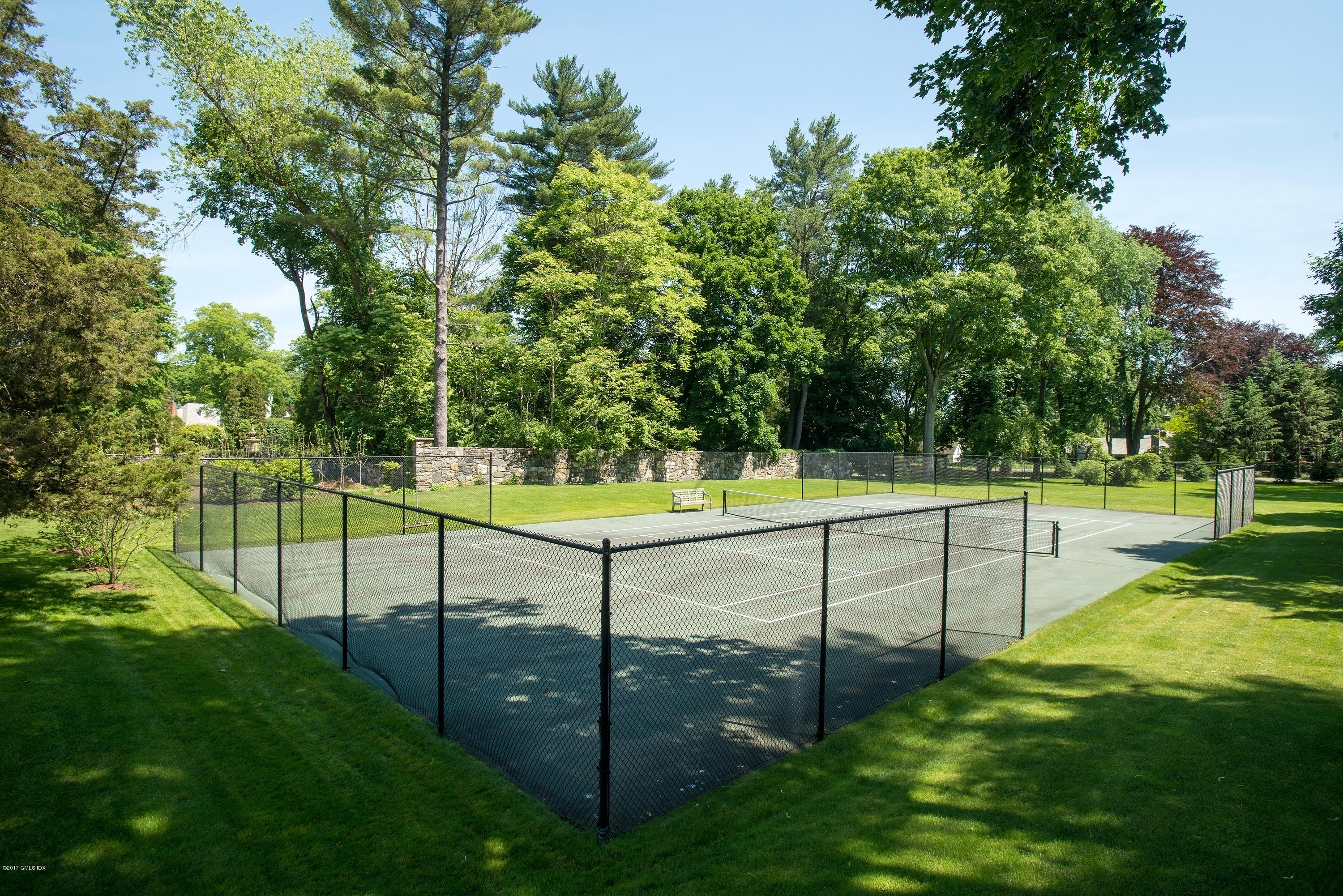 8 Mountain Wood Drive Greenwich, CT 06830 - Photo 21 of 22 a view of a backyard