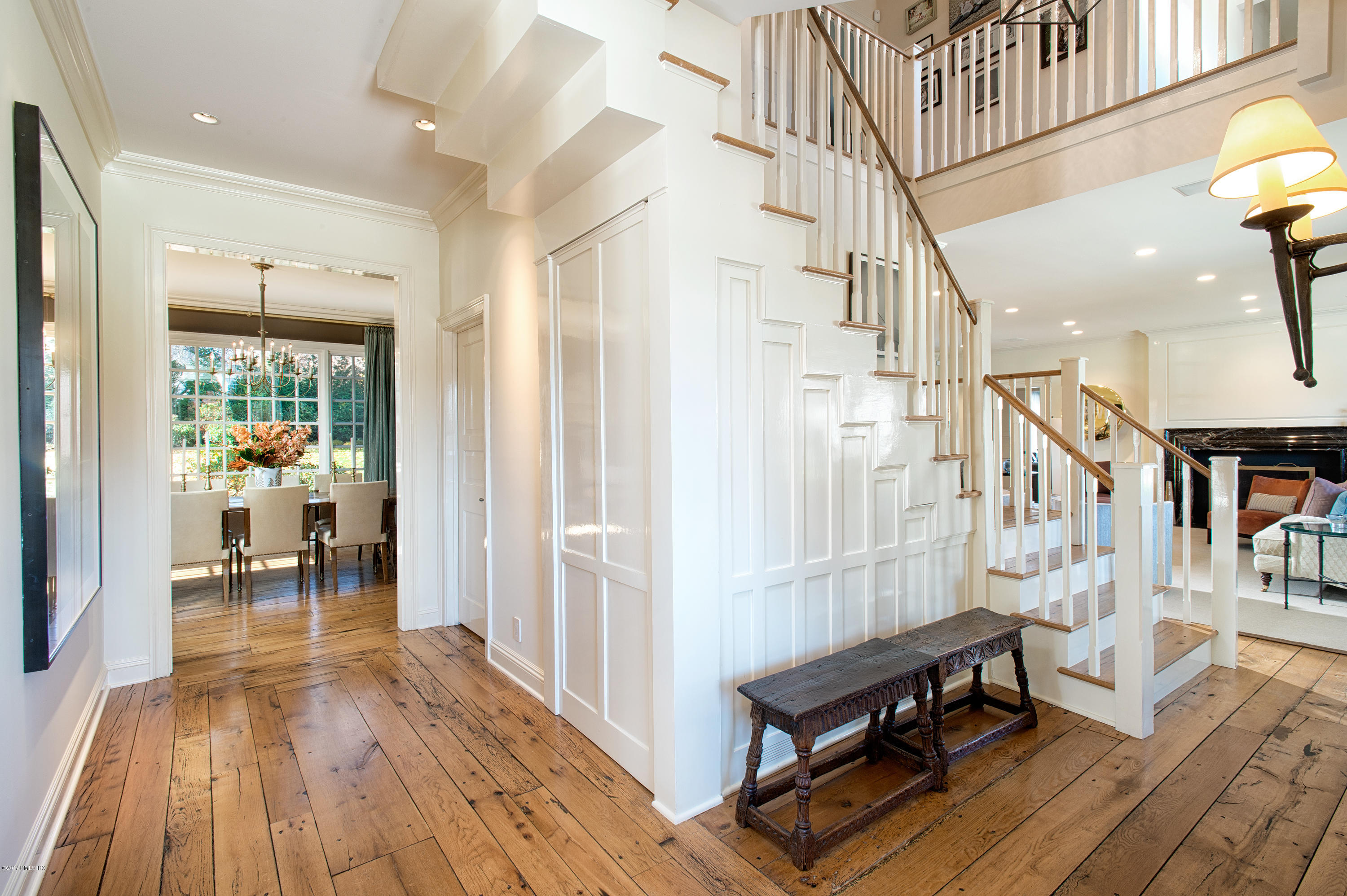 8 Mountain Wood Drive Greenwich, CT 06830 - Photo 3 of 22 a view of a hallway with wooden floor and furniture