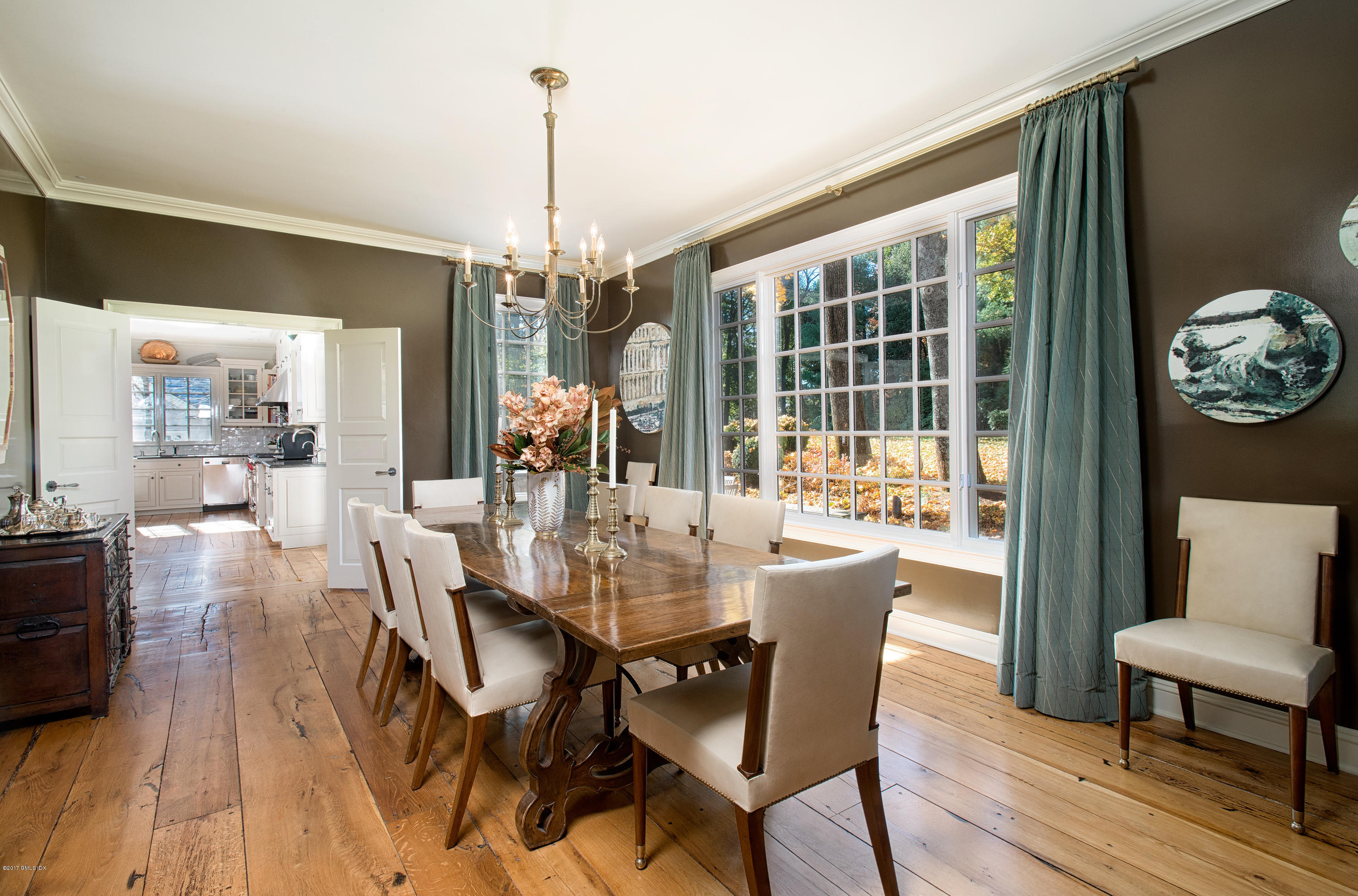 8 Mountain Wood Drive Greenwich, CT 06830 - Photo 5 of 22 a dining room with furniture a chandelier and wooden floor