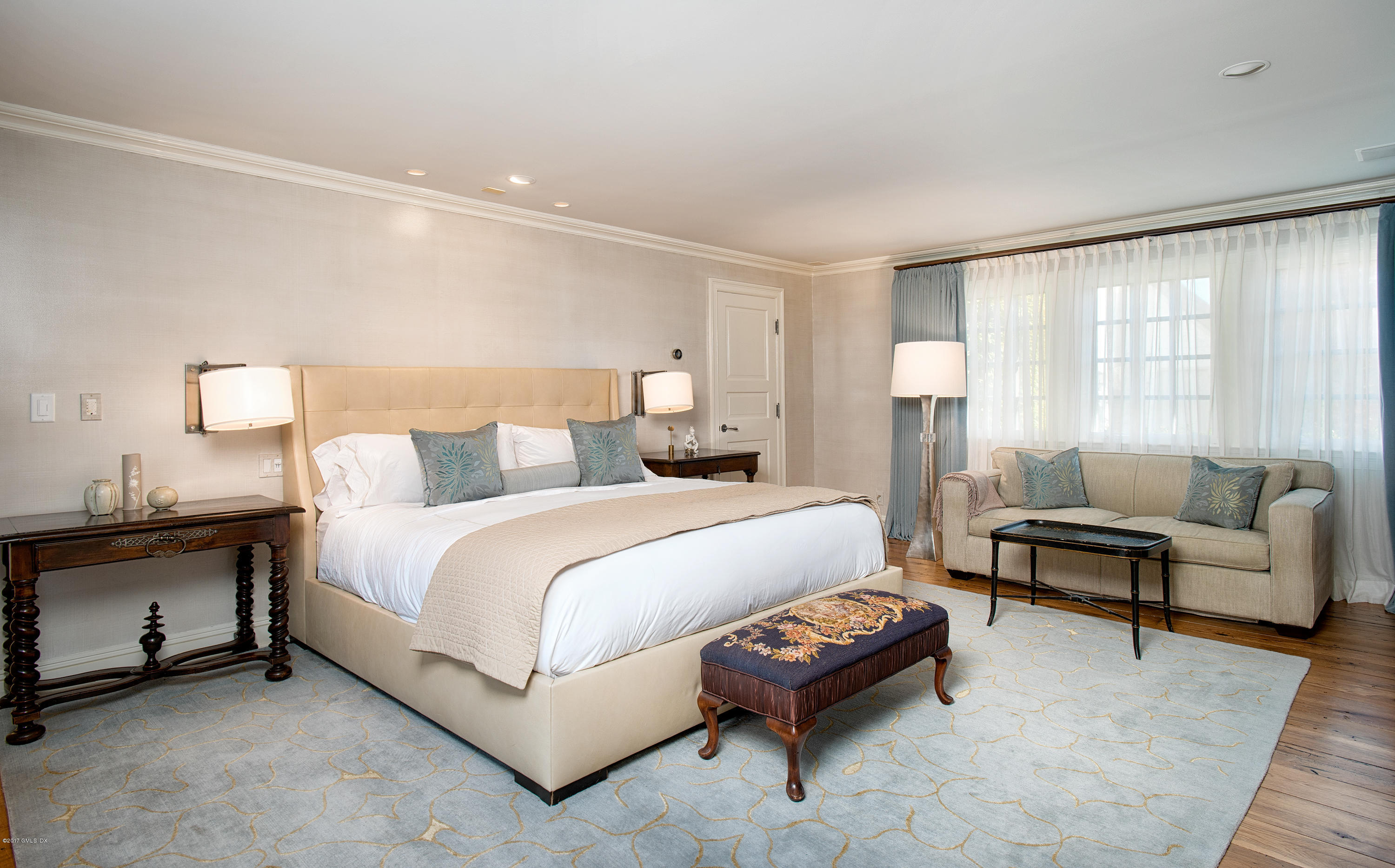 8 Mountain Wood Drive Greenwich, CT 06830 - Photo 7 of 22 a bedroom with a bed and a couch