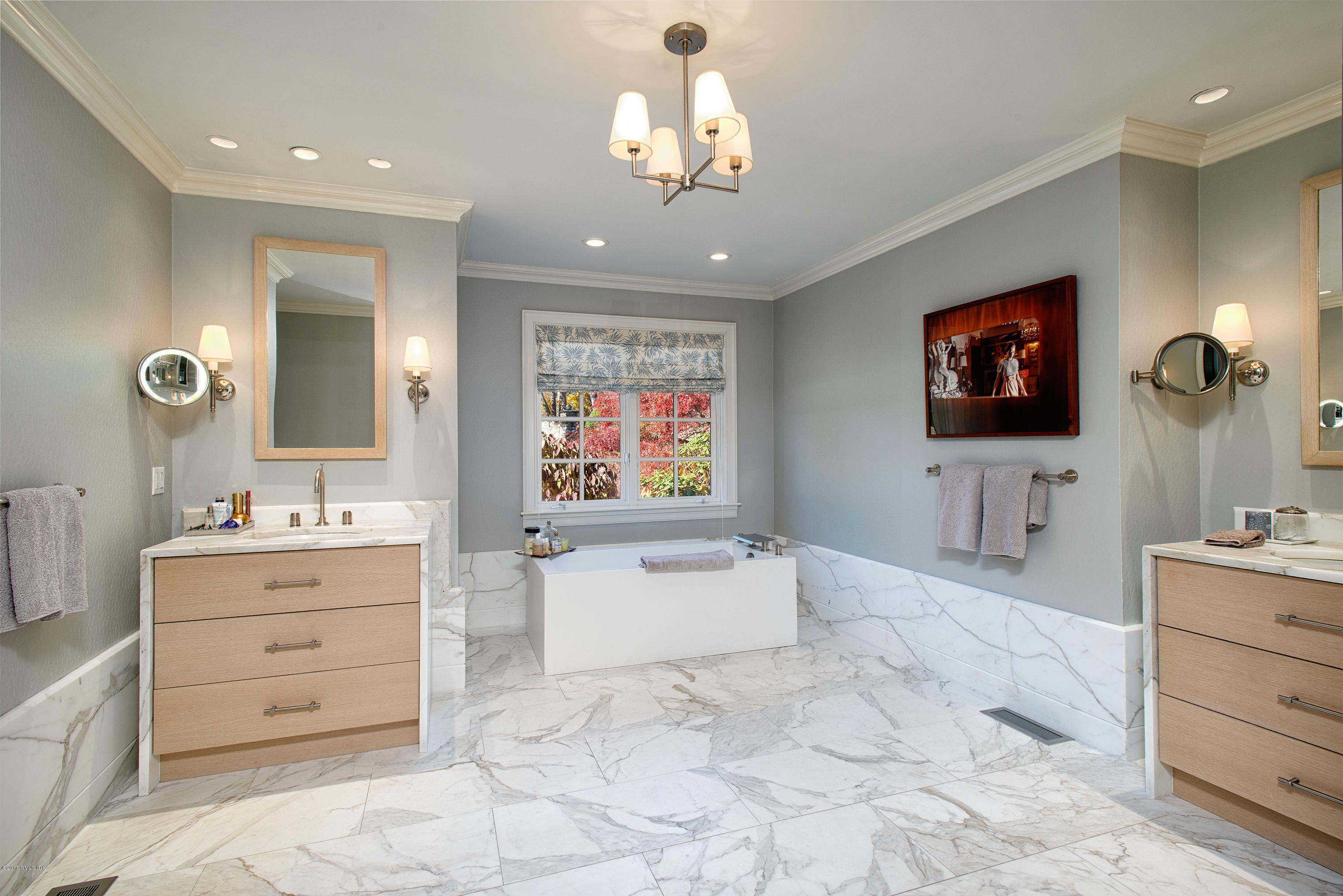 8 Mountain Wood Drive Greenwich, CT 06830 - Photo 8 of 22 a spacious bathroom with a sink a mirror and a bathtub