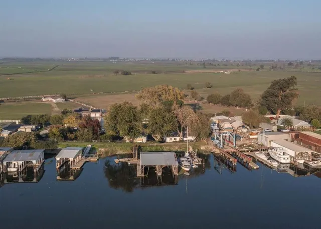 an aerial view of a house with a lake view