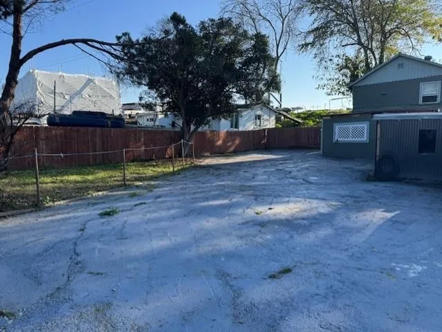 a view of backyard with tree