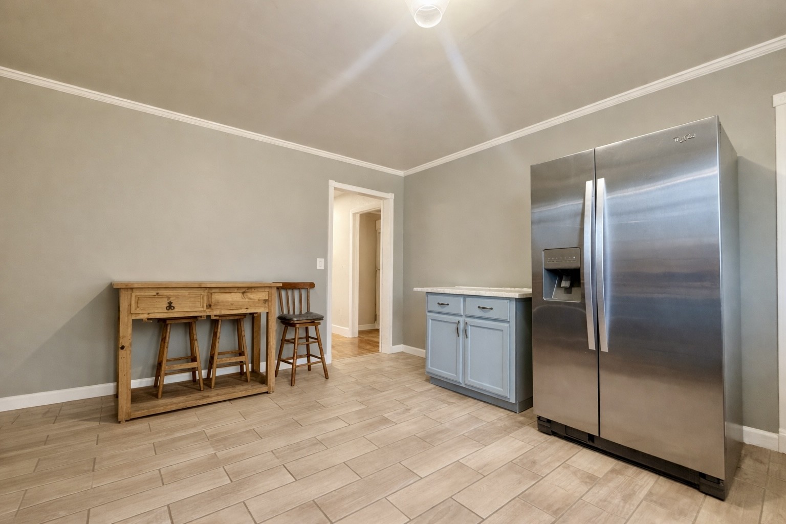 2705 Johnson Branch Road Leoma, TN 38468 - Photo 6 of 16 a view of an empty room with kitchen and a window