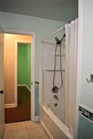 a view of a room with a fan and a fan