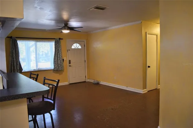 a view of a room with furniture and wooden floor