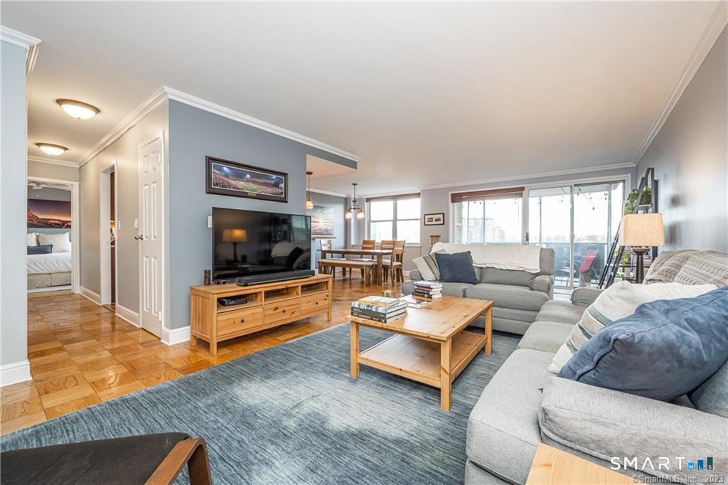 50 Glenbrook Road, Unit 6E Stamford, CT 06902 - Photo 2 of 18 a living room with furniture and a flat screen tv