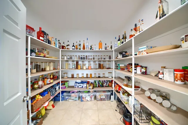a room with furniture and baby shelf