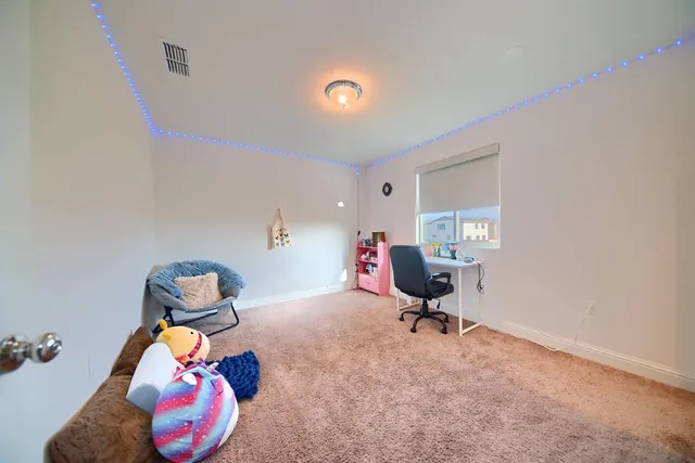 a room with toys and wooden floor