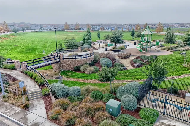 a view of a garden with an outdoor seating