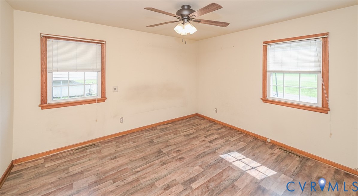 581 Smokey Road Aylett, VA 23009 - Photo 18 of 28 Interior room with wood-finish flooring, two windo