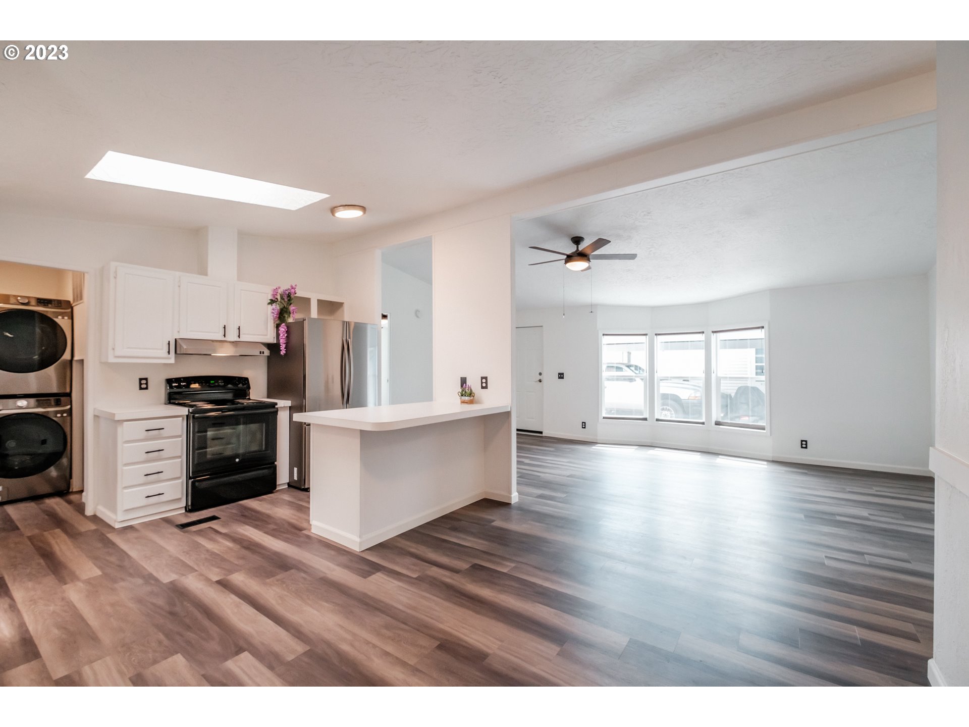 1401 West Ellendale Avenue, Unit 80 Dallas, OR 97338 - Photo 12 of 48 a view of kitchen with sink microwave and refrigerator