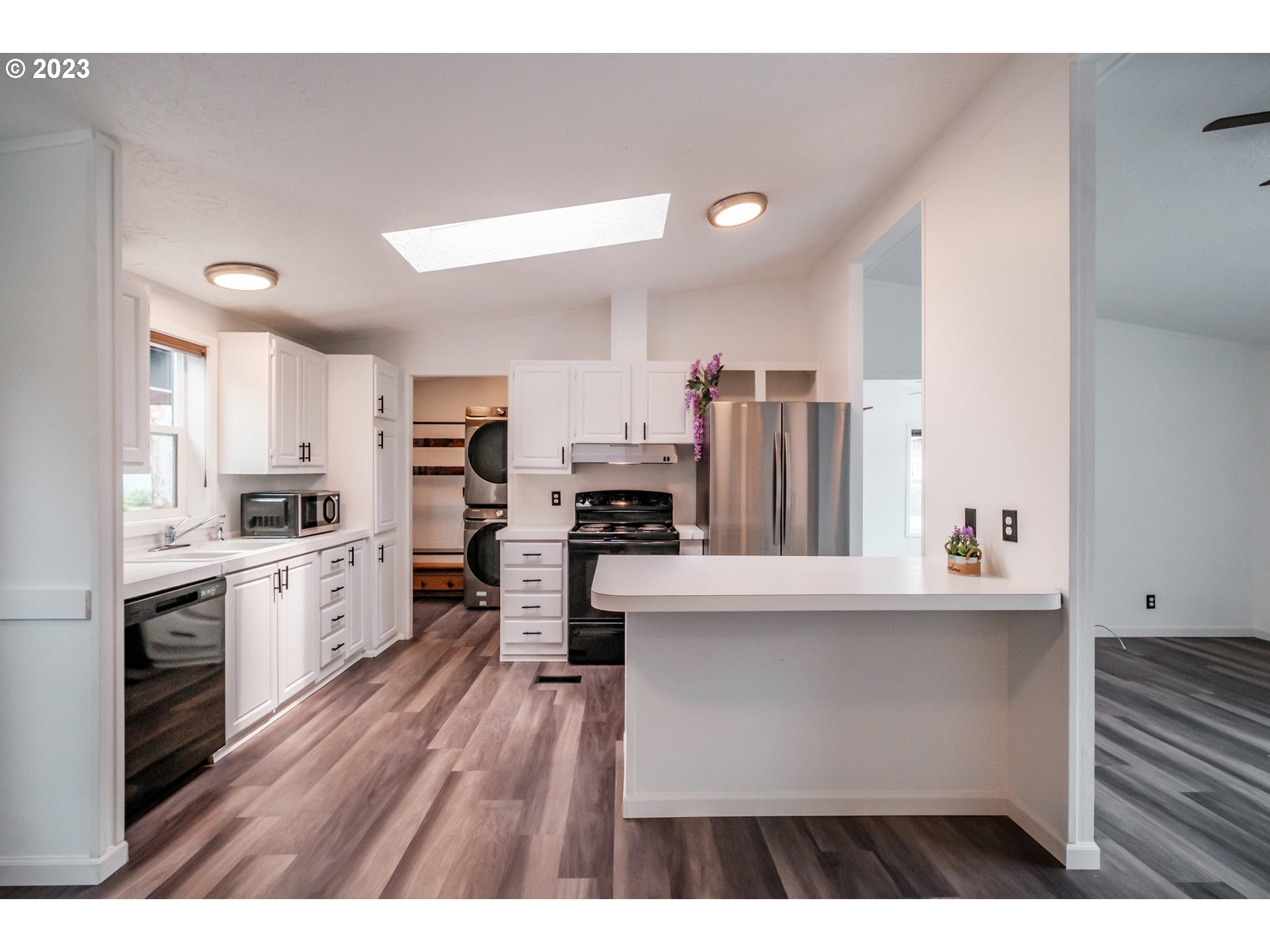 1401 West Ellendale Avenue, Unit 80 Dallas, OR 97338 - Photo 15 of 48 a kitchen with stainless steel appliances a refrigerator sink and stove top oven