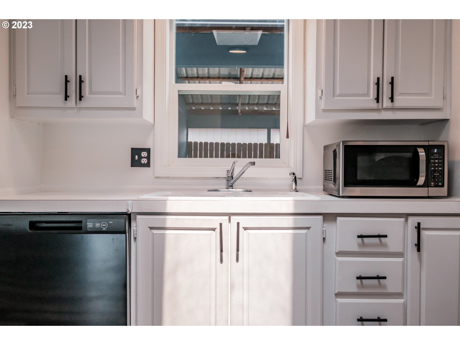 1401 West Ellendale Avenue, Unit 80 Dallas, OR 97338 - Photo 17 of 48 a kitchen with granite countertop a sink and a stove