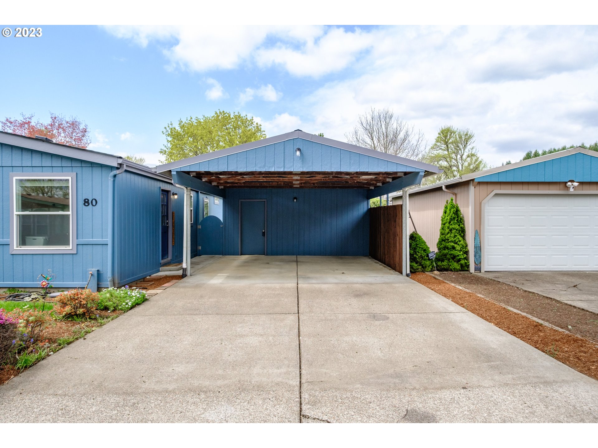1401 West Ellendale Avenue, Unit 80 Dallas, OR 97338 - Photo 3 of 48 a view of a house with a garage