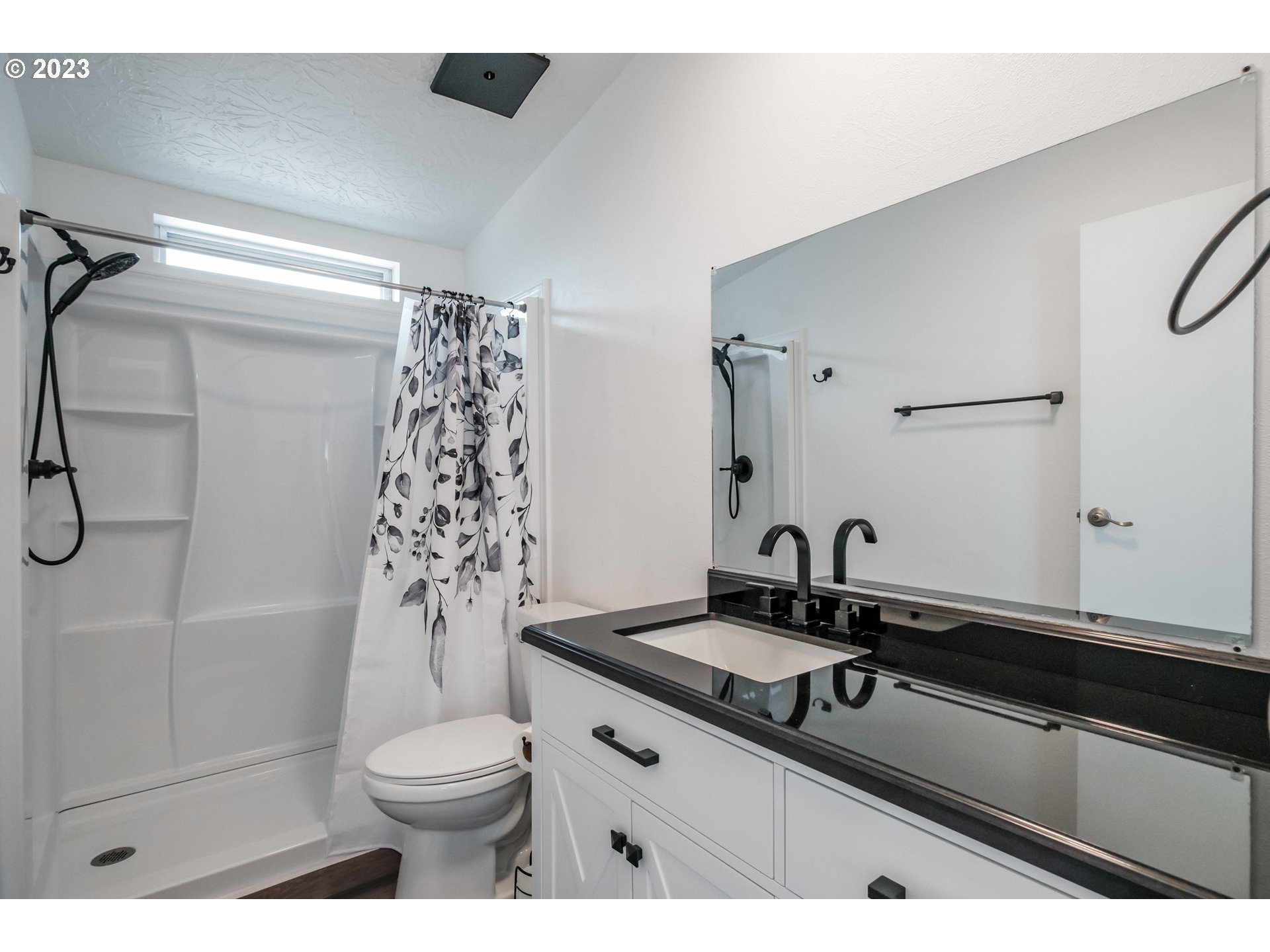 1401 West Ellendale Avenue, Unit 80 Dallas, OR 97338 - Photo 32 of 48 a bathroom with a sink a toilet and shower