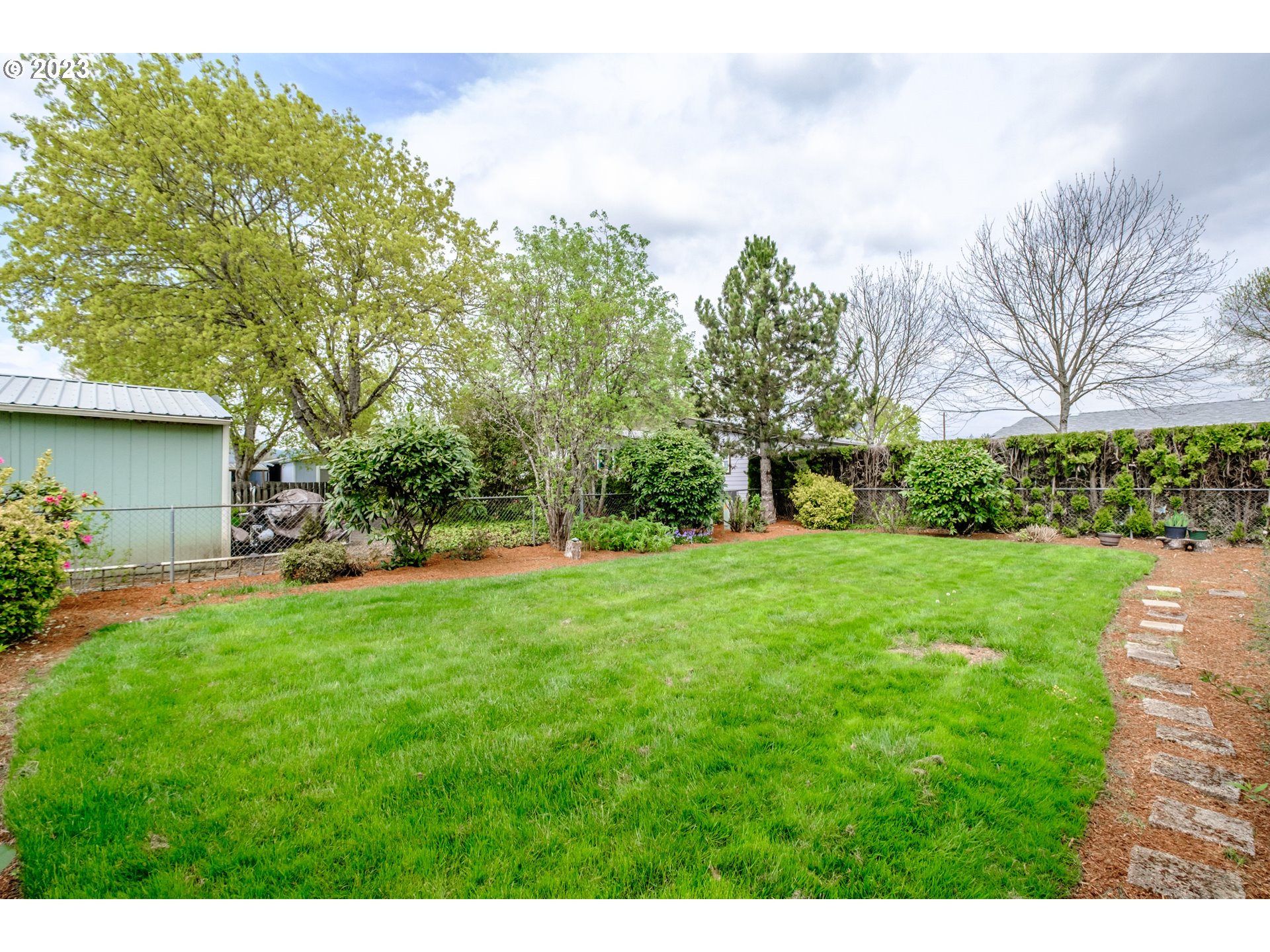 1401 West Ellendale Avenue, Unit 80 Dallas, OR 97338 - Photo 40 of 48 a view of a backyard with a garden