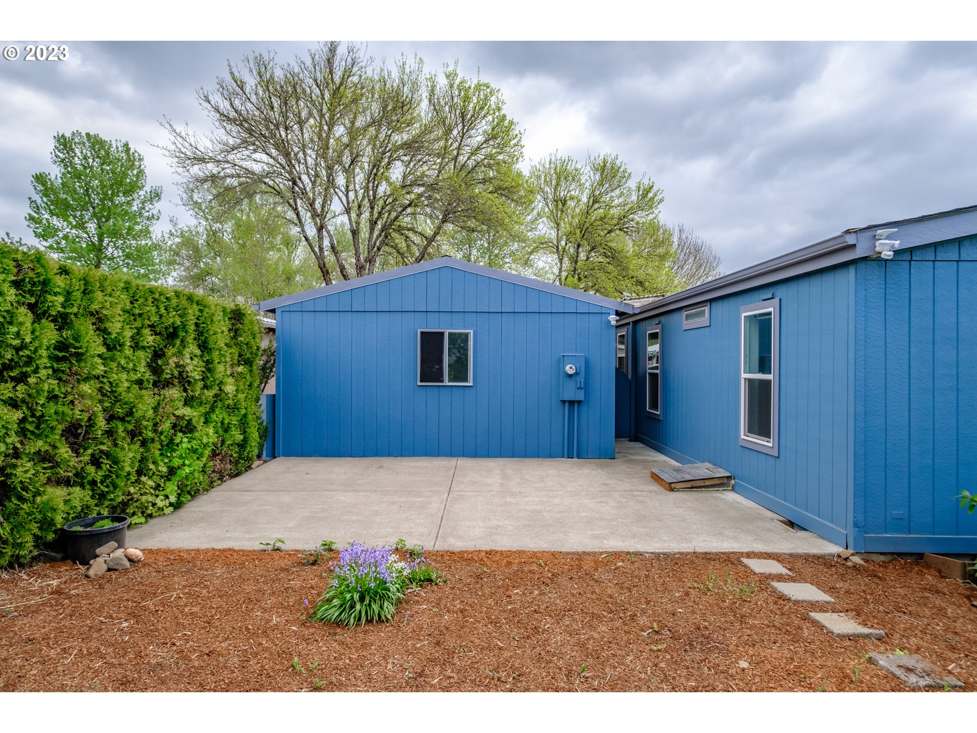 1401 West Ellendale Avenue, Unit 80 Dallas, OR 97338 - Photo 41 of 48 a front view of a house with a yard