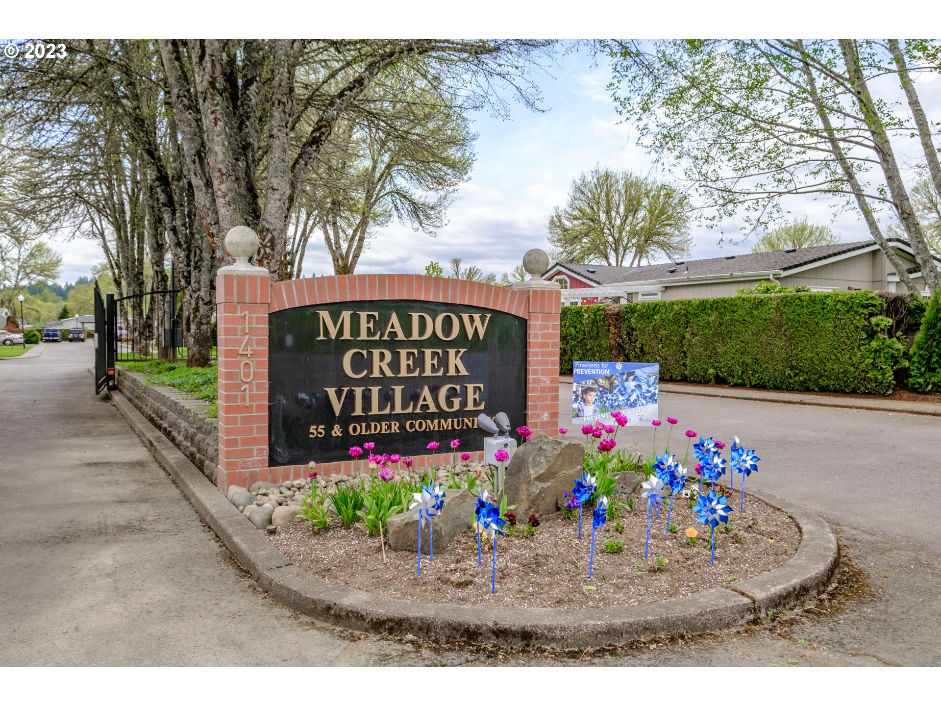 1401 West Ellendale Avenue, Unit 80 Dallas, OR 97338 - Photo 44 of 48 a view of outdoor space with sign board
