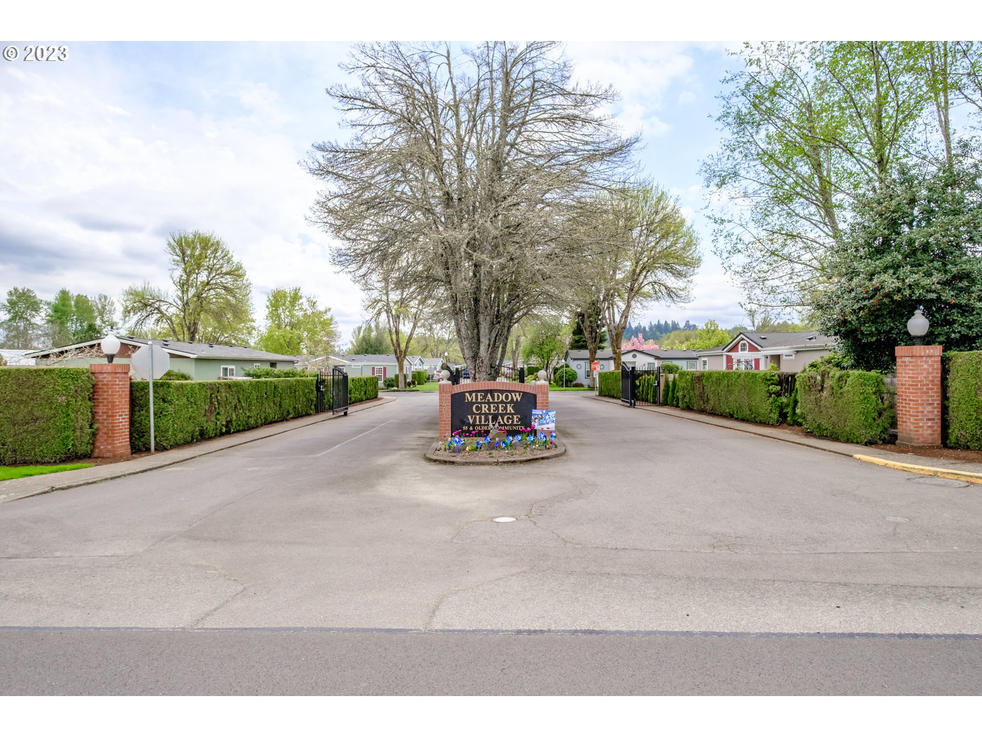 1401 West Ellendale Avenue, Unit 80 Dallas, OR 97338 - Photo 48 of 48 a view of a street with a cars parked on the side of the road
