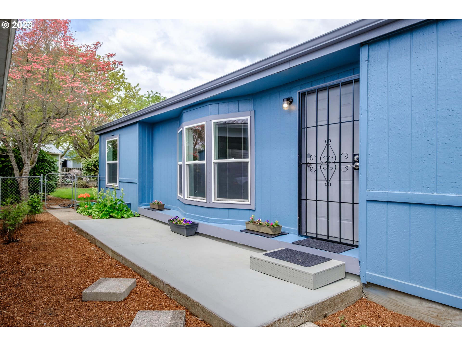 1401 West Ellendale Avenue, Unit 80 Dallas, OR 97338 - Photo 5 of 48 a front view of a house with a yard