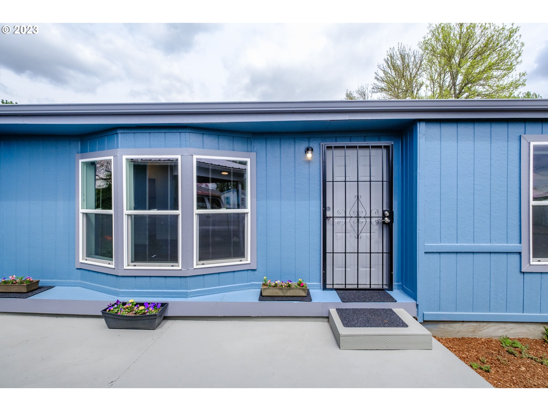 1401 West Ellendale Avenue, Unit 80 Dallas, OR 97338 - Photo 6 of 48 a front view of a house with a street